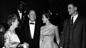 Johnny Mercer mingling with people at a dinner.