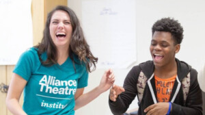 Two students at the Alliance Institute laughing together.