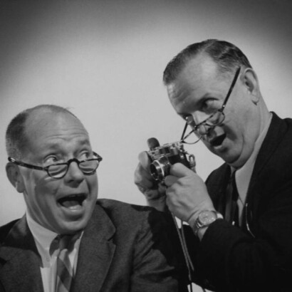 Johnny Mercer laughing with a friend.