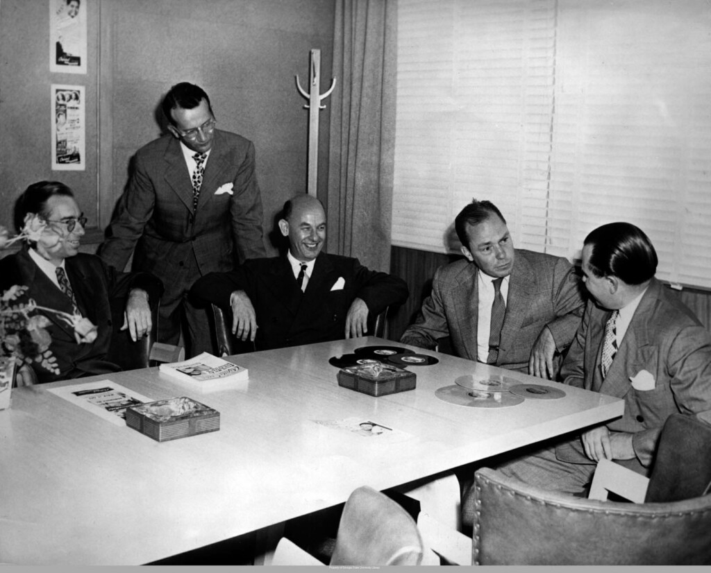 Paul Weston and Johnny Mercer at a meeting at Capitol Records.
