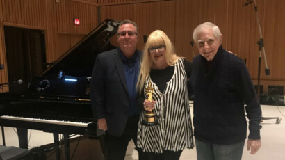 Rose Kingsley in Capitol Studios with Jim Corwin (Johnny’s grandson), Bob Corwin, and one of Johnny’s Academy Awards.